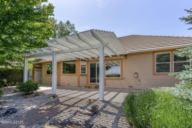 Nestled in a gated golf course community and overlooking serene on Genoa Lakes Golf Club - Lakes Course in Nevada - for sale on GolfHomes.com, golf home, golf lot
