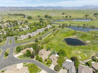 Nestled in a gated golf course community and overlooking serene on Genoa Lakes Golf Club - Lakes Course in Nevada - for sale on GolfHomes.com, golf home, golf lot