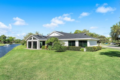 This beautifully renovated home sits on a spacious corner lot on  in Florida - for sale on GolfHomes.com, golf home, golf lot