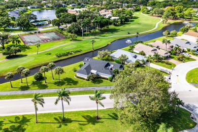 This beautifully renovated home sits on a spacious corner lot on  in Florida - for sale on GolfHomes.com, golf home, golf lot