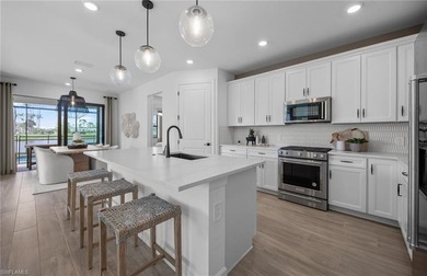 This stunning Mystique Home with breathtaking preserve views on Valencia Golf and Country Club in Florida - for sale on GolfHomes.com, golf home, golf lot