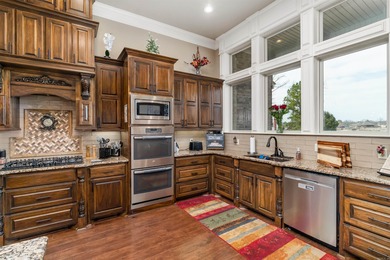 Stunning Lake Maria home featuring a private boat dock and on Isabella Golf Course  in Arkansas - for sale on GolfHomes.com, golf home, golf lot