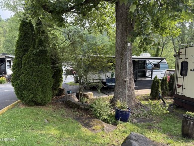 Beautifully landscaped pull-through corner RV lot in the sought on Bent Creek Golf Course in Tennessee - for sale on GolfHomes.com, golf home, golf lot