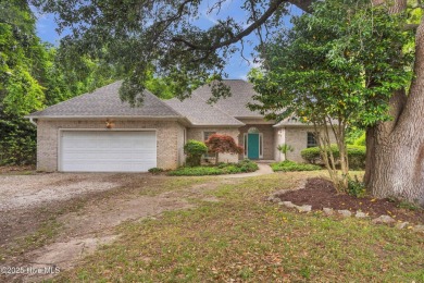 Tucked away on a spacious, pie-shaped lot, this hidden gem on on Olde Point Golf and Country Club in North Carolina - for sale on GolfHomes.com, golf home, golf lot