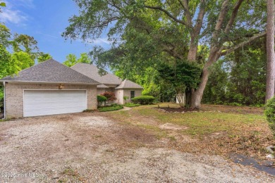 Tucked away on a spacious, pie-shaped lot, this hidden gem on on Olde Point Golf and Country Club in North Carolina - for sale on GolfHomes.com, golf home, golf lot