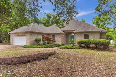 Tucked away on a spacious, pie-shaped lot, this hidden gem on on Olde Point Golf and Country Club in North Carolina - for sale on GolfHomes.com, golf home, golf lot