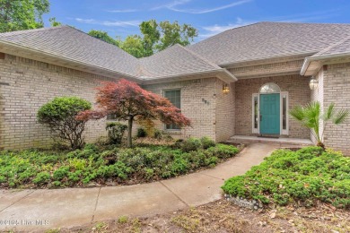 Tucked away on a spacious, pie-shaped lot, this hidden gem on on Olde Point Golf and Country Club in North Carolina - for sale on GolfHomes.com, golf home, golf lot
