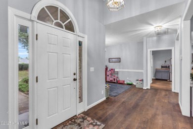 Tucked away on a spacious, pie-shaped lot, this hidden gem on on Olde Point Golf and Country Club in North Carolina - for sale on GolfHomes.com, golf home, golf lot