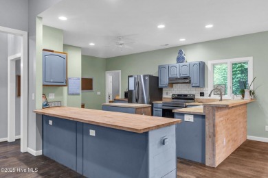 Tucked away on a spacious, pie-shaped lot, this hidden gem on on Olde Point Golf and Country Club in North Carolina - for sale on GolfHomes.com, golf home, golf lot