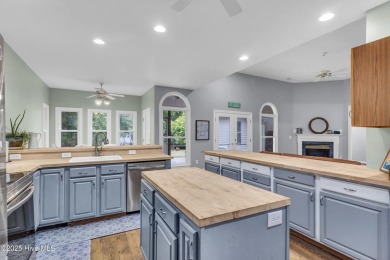 Tucked away on a spacious, pie-shaped lot, this hidden gem on on Olde Point Golf and Country Club in North Carolina - for sale on GolfHomes.com, golf home, golf lot