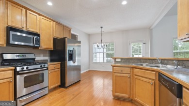 Discover this beautifully maintained 5-bedroom, 3.5 bath home on Summergrove Golf Club in Georgia - for sale on GolfHomes.com, golf home, golf lot