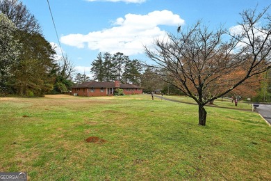 Nestled on one of the largest residential lots in the charming on College Park Municipal Golf Course in Georgia - for sale on GolfHomes.com, golf home, golf lot
