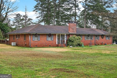 Nestled on one of the largest residential lots in the charming on College Park Municipal Golf Course in Georgia - for sale on GolfHomes.com, golf home, golf lot