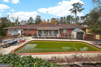 Nestled on one of the largest residential lots in the charming on College Park Municipal Golf Course in Georgia - for sale on GolfHomes.com, golf home, golf lot