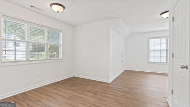 Discover this beautifully maintained 5-bedroom, 3.5 bath home on Summergrove Golf Club in Georgia - for sale on GolfHomes.com, golf home, golf lot