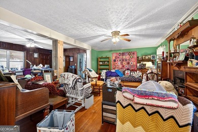 Nestled on one of the largest residential lots in the charming on College Park Municipal Golf Course in Georgia - for sale on GolfHomes.com, golf home, golf lot