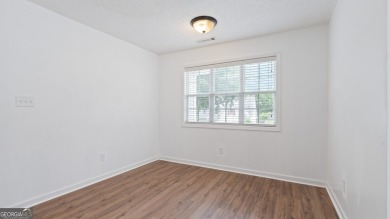 Discover this beautifully maintained 5-bedroom, 3.5 bath home on Summergrove Golf Club in Georgia - for sale on GolfHomes.com, golf home, golf lot