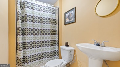 Discover this beautifully maintained 5-bedroom, 3.5 bath home on Summergrove Golf Club in Georgia - for sale on GolfHomes.com, golf home, golf lot