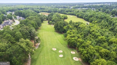 Discover this beautifully maintained 5-bedroom, 3.5 bath home on Summergrove Golf Club in Georgia - for sale on GolfHomes.com, golf home, golf lot