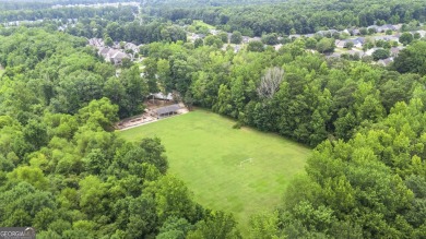Discover this beautifully maintained 5-bedroom, 3.5 bath home on Summergrove Golf Club in Georgia - for sale on GolfHomes.com, golf home, golf lot