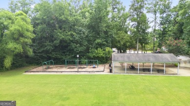 Discover this beautifully maintained 5-bedroom, 3.5 bath home on Summergrove Golf Club in Georgia - for sale on GolfHomes.com, golf home, golf lot