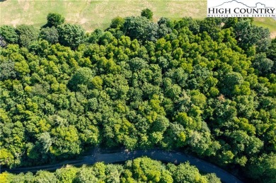 Discover the scenic mountain beauty with this .985-acre lot in on Mountain Aire Golf Course in North Carolina - for sale on GolfHomes.com, golf home, golf lot