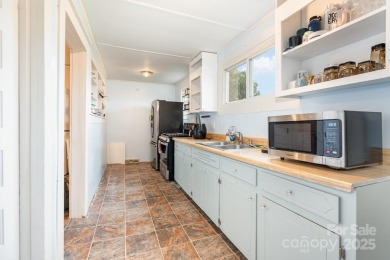 380 Woodlawn Avenue in Cramerton, NC, is a charming 2-bedroom on Cramer Mountain Country Club in North Carolina - for sale on GolfHomes.com, golf home, golf lot