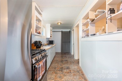 380 Woodlawn Avenue in Cramerton, NC, is a charming 2-bedroom on Cramer Mountain Country Club in North Carolina - for sale on GolfHomes.com, golf home, golf lot