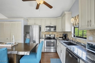 Discover effortless coastal charm in this rare end-unit villa on Rotonda Golf and Country Club The Palms Course in Florida - for sale on GolfHomes.com, golf home, golf lot