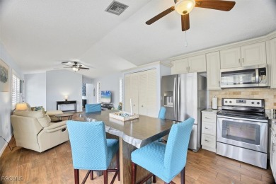 Discover effortless coastal charm in this rare end-unit villa on Rotonda Golf and Country Club The Palms Course in Florida - for sale on GolfHomes.com, golf home, golf lot
