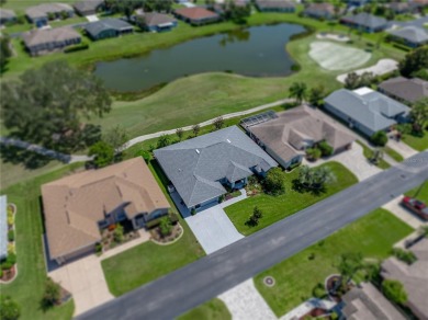 STUNNING CURB APPEAL on this GORGEOUS FULLY REMODELED PANORAMIC on Tampa Bay Golf and Country Club in Florida - for sale on GolfHomes.com, golf home, golf lot
