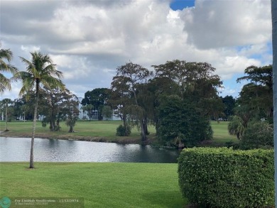 Corner 2-bedroom 2-bathroom unit with elevator and 2nd floor on Oriole Golf and Tennis Club in Florida - for sale on GolfHomes.com, golf home, golf lot