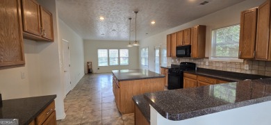 Welcome to this spacious 4-bedroom, 2.5-bath home perfectly on Indian Creek Golf Club in Georgia - for sale on GolfHomes.com, golf home, golf lot