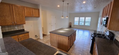 Welcome to this spacious 4-bedroom, 2.5-bath home perfectly on Indian Creek Golf Club in Georgia - for sale on GolfHomes.com, golf home, golf lot