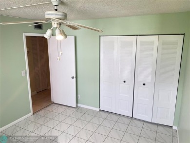 Corner 2-bedroom 2-bathroom unit with elevator and 2nd floor on Oriole Golf and Tennis Club in Florida - for sale on GolfHomes.com, golf home, golf lot