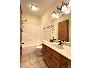 Meticulously maintained home with gorgeous lake views! Vinyl on Lake Perry Country Club in Kansas - for sale on GolfHomes.com, golf home, golf lot