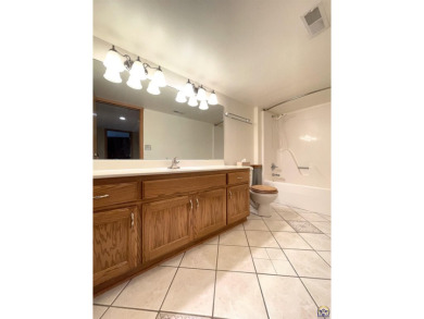 Meticulously maintained home with gorgeous lake views! Vinyl on Lake Perry Country Club in Kansas - for sale on GolfHomes.com, golf home, golf lot