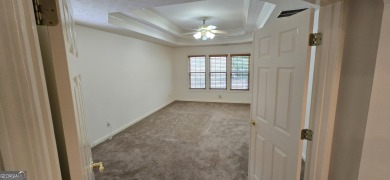 Welcome to this spacious 4-bedroom, 2.5-bath home perfectly on Indian Creek Golf Club in Georgia - for sale on GolfHomes.com, golf home, golf lot