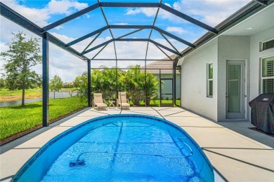 This newly built, elegant pool home backs to a serene lake on Bent Pine Golf Club in Florida - for sale on GolfHomes.com, golf home, golf lot