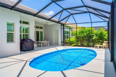 This newly built, elegant pool home backs to a serene lake on Bent Pine Golf Club in Florida - for sale on GolfHomes.com, golf home, golf lot