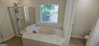 Welcome to this spacious 4-bedroom, 2.5-bath home perfectly on Indian Creek Golf Club in Georgia - for sale on GolfHomes.com, golf home, golf lot