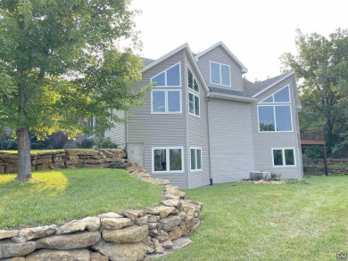 Meticulously maintained home with gorgeous lake views! Vinyl on Lake Perry Country Club in Kansas - for sale on GolfHomes.com, golf home, golf lot