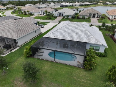 This newly built, elegant pool home backs to a serene lake on Bent Pine Golf Club in Florida - for sale on GolfHomes.com, golf home, golf lot