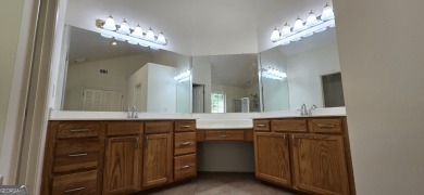 Welcome to this spacious 4-bedroom, 2.5-bath home perfectly on Indian Creek Golf Club in Georgia - for sale on GolfHomes.com, golf home, golf lot