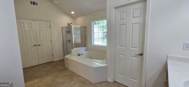 Welcome to this spacious 4-bedroom, 2.5-bath home perfectly on Indian Creek Golf Club in Georgia - for sale on GolfHomes.com, golf home, golf lot