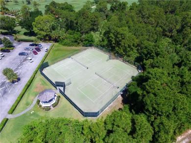 This newly built, elegant pool home backs to a serene lake on Bent Pine Golf Club in Florida - for sale on GolfHomes.com, golf home, golf lot