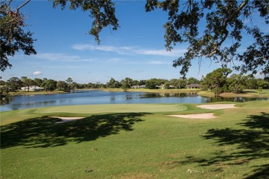 This newly built, elegant pool home backs to a serene lake on Bent Pine Golf Club in Florida - for sale on GolfHomes.com, golf home, golf lot