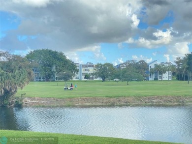 Corner 2-bedroom 2-bathroom unit with elevator and 2nd floor on Oriole Golf and Tennis Club in Florida - for sale on GolfHomes.com, golf home, golf lot