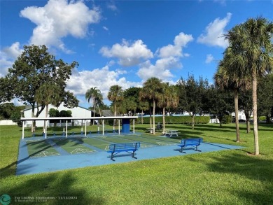 Corner 2-bedroom 2-bathroom unit with elevator and 2nd floor on Oriole Golf and Tennis Club in Florida - for sale on GolfHomes.com, golf home, golf lot