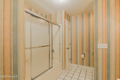 Opportunity knocks with this 1-bedroom condo in a gated golf on Brunswick Plantation and Golf Resorts in North Carolina - for sale on GolfHomes.com, golf home, golf lot